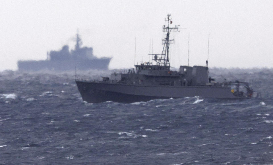 FILE - A Japanese Maritime Self Defense Force minesweeper searches in the waters where a U.S. military Osprey aircraft crashed, off Yakushima, Kagoshima prefecture, southern Japan, on Dec. 1, 2023. The U.S. Air Force on Friday, Jan. 12, 2024 announced the end of its more than a month long search and recovery operation at the site of a CV-22B Osprey crash that occurred off the southern Japanese coast in late November, expressing regret at not being able to find the last of the eight crew members killed. (Kyodo News via AP, File)