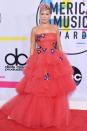 <p>Pink was rocking a unique look of some serious red ruffles. Her dress also had an intricate blue flower pattern.</p>