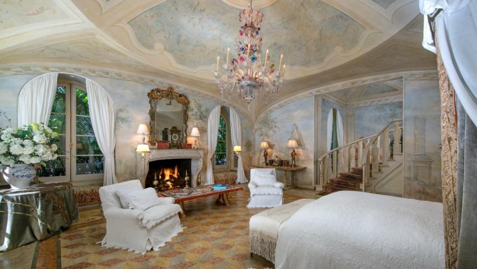 The Tuscan-style villa features hand-painted Italian frescoes, including in a bedroom. - Credit: Jim Bartsch