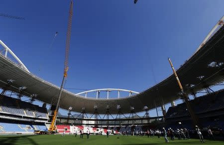 Members of the media visit the Joao Havelange Olympic Stadium, undergoing renovation to stage athletic competitions during the Rio 2016 Olympic Games, during the 2nd world press briefing for the games in Rio de Janeiro August 6, 2014. REUTERS/Sergio Moraes