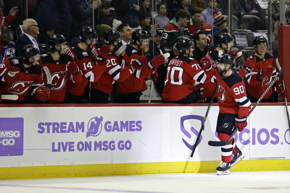 New Jersey Devils left wing Tomas Tatar (90) celebrates with teammates after scoring a goal against the Edmonton Oilers during the third period of an NHL hockey game Monday, Nov. 21, 2022, in Newark, N.J. (AP Photo/Adam Hunger)