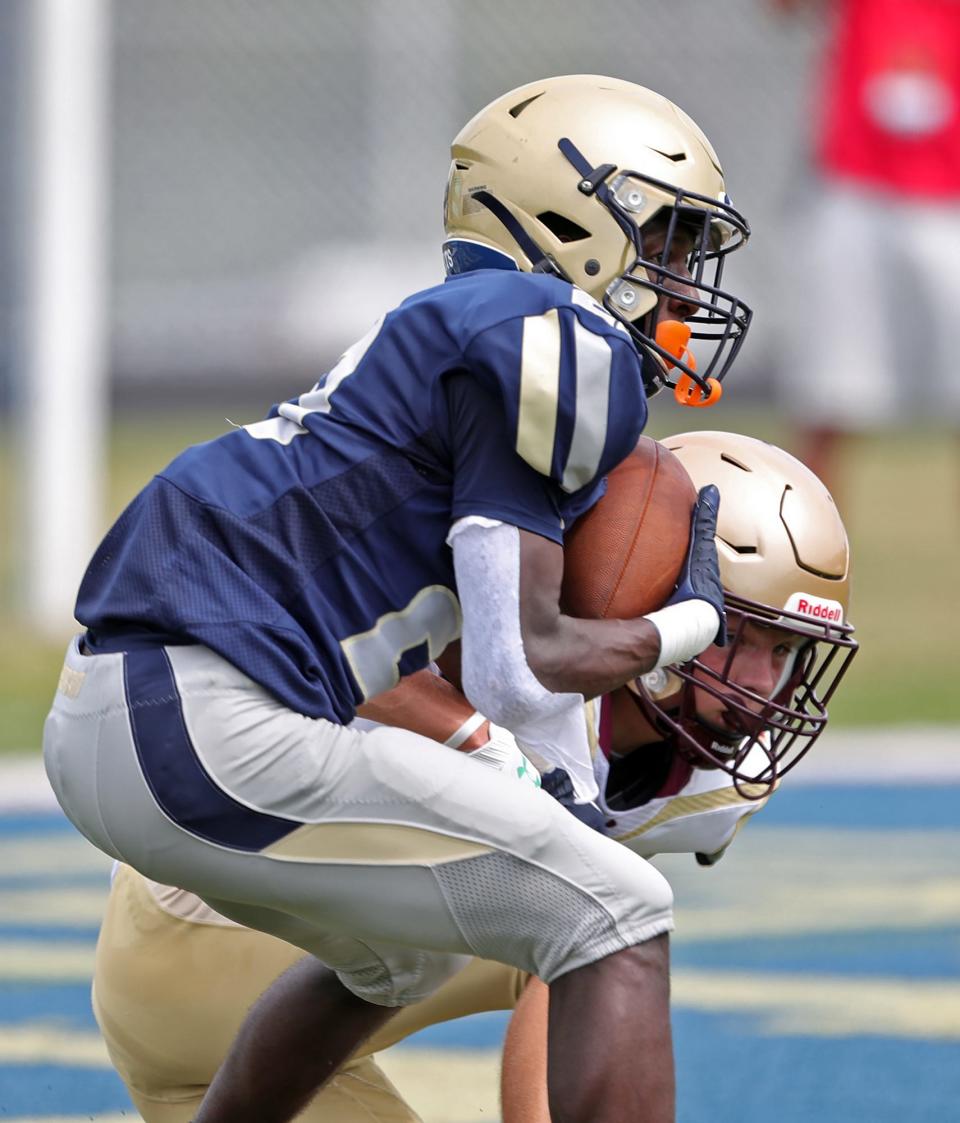 Hoban defensive back Xavier Williams intercepts a first-half pass intended for Iona Prep's Michael Senatore on Sept. 3, 2022.