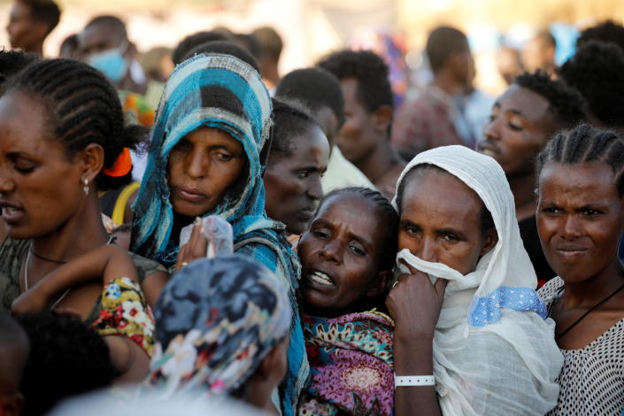 Ethiopian refugees stand in for supplies at the Um Rakuba refugee camp which houses refugees fleeing the fighting in the Tigray region, on the Sudan-Ethiopia border in Sudan. (Baz Ratner/Reuters)