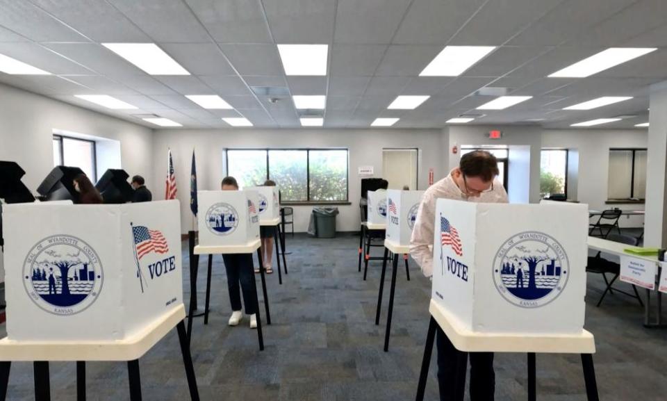 Voter mark their ballots during the primary election and abortion referendum at a Wyandotte county polling station in Kansas City, Kansas.