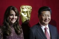 China's President Xi Jinping, stands with Britain's Catherine, Duchess of Cambridge, as they attend a attend a BAFTA presentation at Lancaster House in London, Britain October 21, 2015. REUTERS/Adrian Dennis/pool