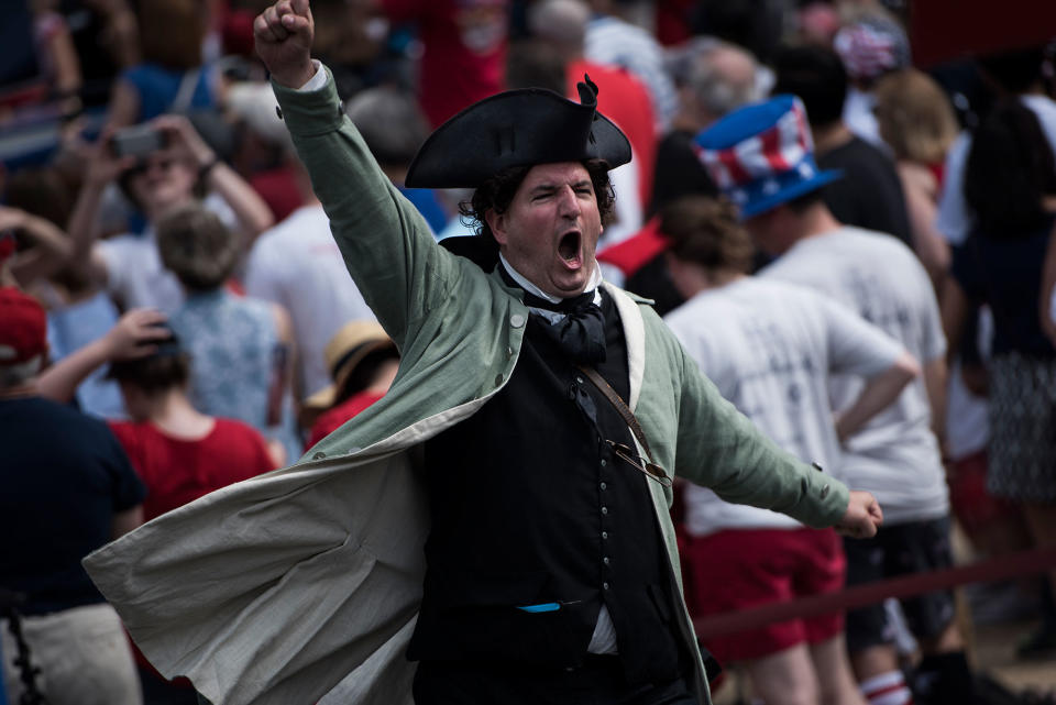 <p>A costumed man cheers during a show outside the National Archives to celebrate Independence Day on July 4, 2017 in Washington, D.C. (Photo: Brendan Smialowski/AFP/Getty Images) </p>