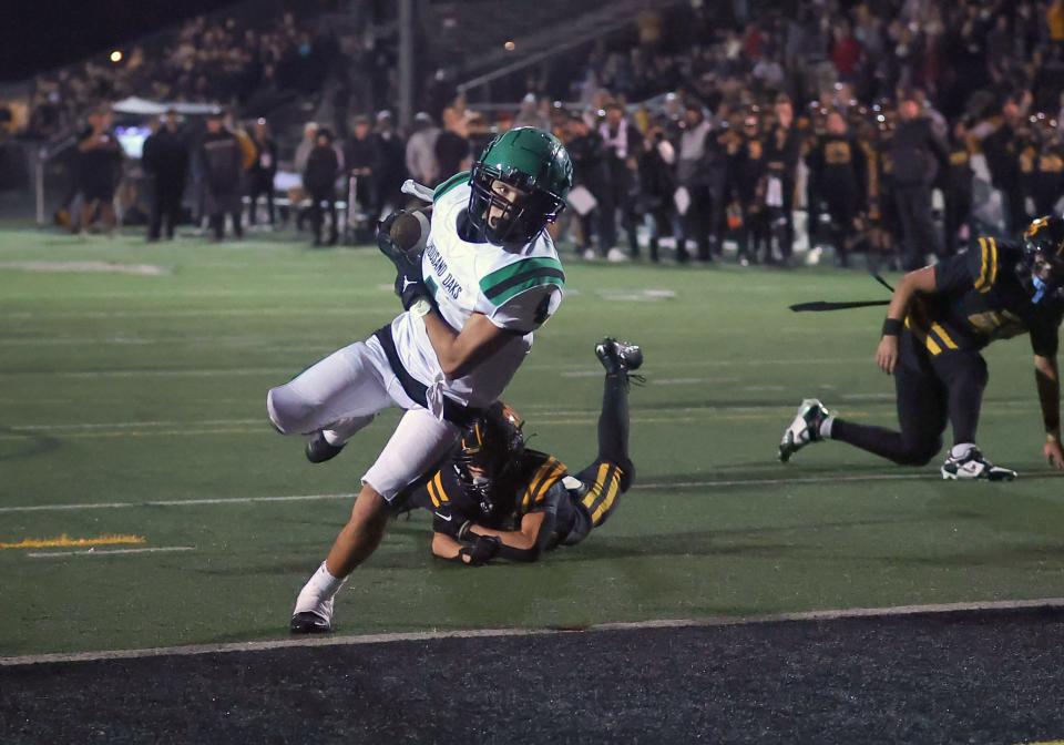 Thousand Oaks High's Brolin Harrah scores a touchdown against Newbury Park during the teams' CIF-SS Division 5 semifinal game on Nov. 17.