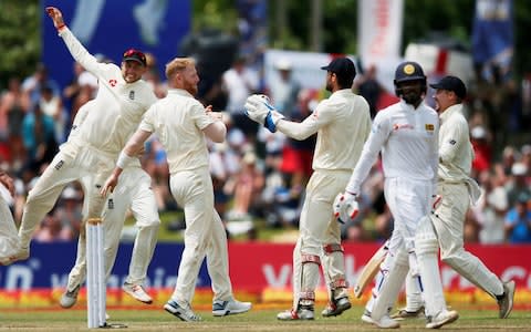 England's captain Joe Root (L) and Ben Stokes (2nd L) celebrate with teammates the dismissal of Sri Lanka's Dhananjaya de Silva - Credit:  REUTERS/Dinuka Liyanawatte