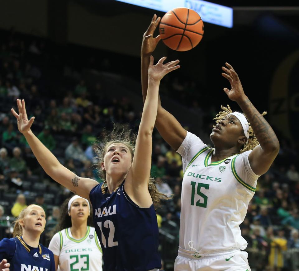 Oregon’s Phillipina Kyei, right, pulls down a rebound over Northern Arizona’s Sophie Glancey during the second half at Matthew Knight Arena on Nov 6 in Eugene.