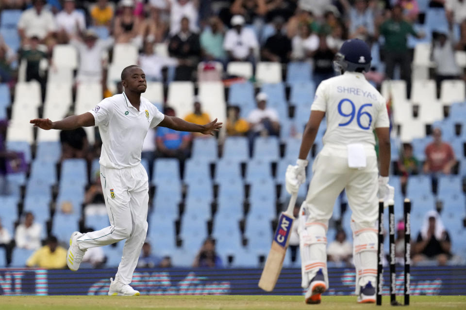 South Africa's bowler Kagiso Rabada, left, celebrates after bowling India's batsman Shreyas Iyer for 31 runs during the first day of the Test cricket match between South Africa and India, at Centurion Park, South Africa, Tuesday, Dec. 26, 2023. (AP Photo/Themba Hadebe)