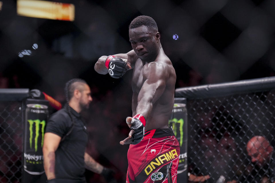 Jun 24, 2023; Jacksonville, Florida, USA; David Onama (red gloves) celebrates after he knocks out Gabriel Santos (blue gloves) in a featherweight bout during UFC Fight Night at VyStar Veterans Memorial Arena. Mandatory Credit: David Yeazell-USA TODAY Sports