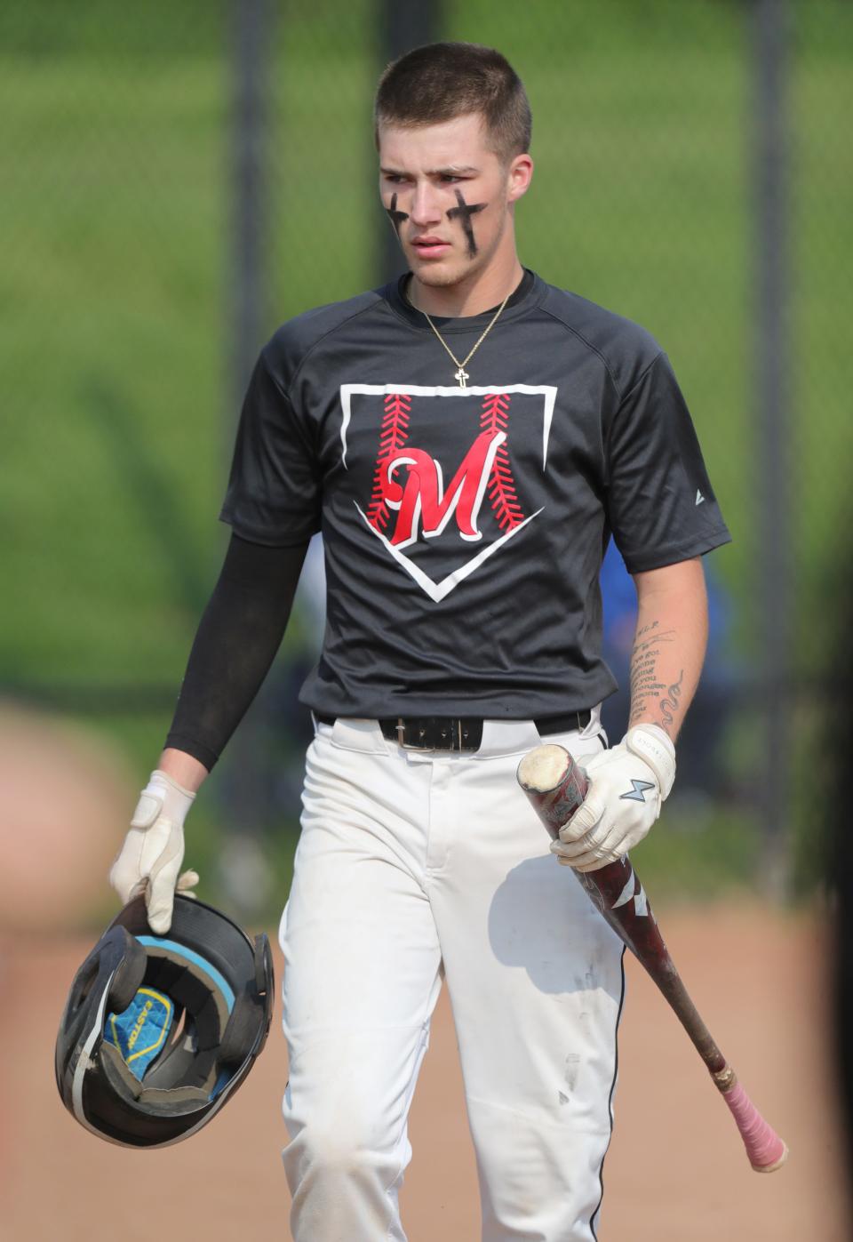 Manchester baseball's Owen Canter walks off the field during a Division III sectional final against Crestwood, Wednesday, May 17, 2023.