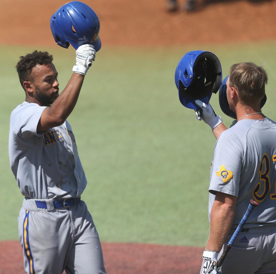 Angelo State University's Koby Kelton, left, is congratulated by teammates after hitting a home run against Colorado Mesa during Game 2 of the Super Regional at Foster Field at 1st Community Credit Union Stadium on Saturday, May 28, 2022.