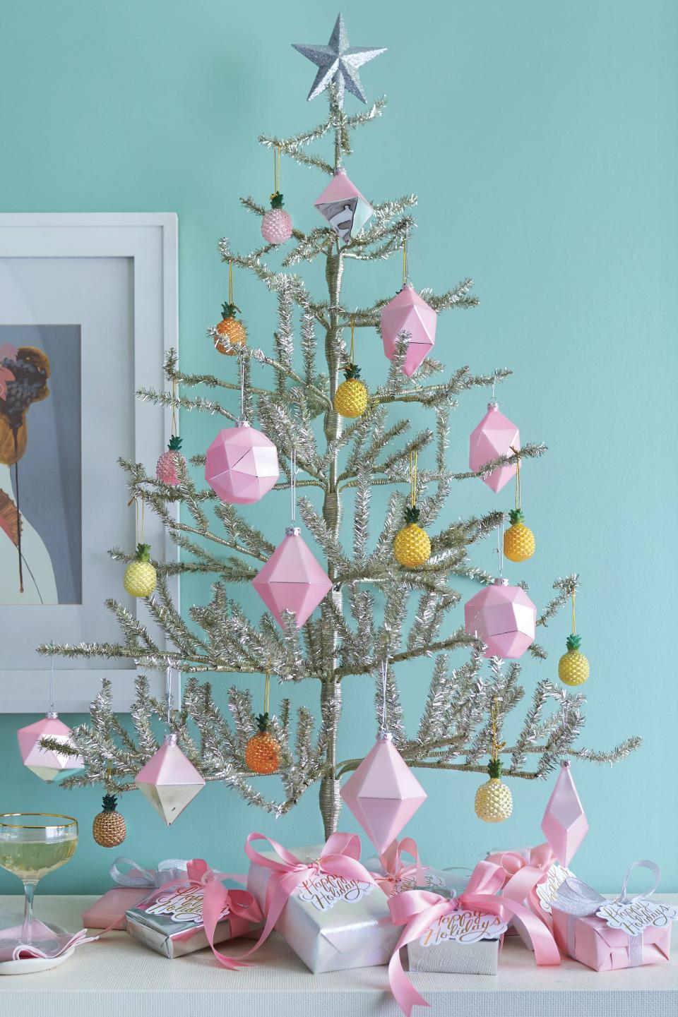 <p>If you're not afraid of a little sparkle, go for a super fun tinsel tree and some shiny pink and silver ornaments. Throw in a few mini pineapples for an extra splash of joy.</p> <p><strong>Get the Look</strong><br> For a similar look, try Glitter Star Tree Topper, $17; <a href="http://www.anrdoezrs.net/links/7885610/type/dlg/sid/SL%2CRX_1812_ChristmasTreeGlitzyMetallicTree%2Crellis1271%2CCHR%2CIMA%2C560699%2C201811%2CI/https://www.wayfair.com/holiday-decor/pdp/queens-of-christmas-glitter-star-tree-topper-winl1794.html?piid=12387885" rel="nofollow noopener" target="_blank" data-ylk="slk:wayfair.com" class="link ">wayfair.com</a><br> For a similar look, try Solid Fabric Satin Ribbon, $9; <a href="https://ribbons.com/fabric-satin-ribbon/id=106503" rel="nofollow noopener" target="_blank" data-ylk="slk:ribbons.com" class="link ">ribbons.com</a><br> Happy Holidays Tags, $10/set of 8; <a href="http://www.anrdoezrs.net/links/7885610/type/dlg/sid/SL%2CRX_1812_ChristmasTreeGlitzyMetallicTree%2Crellis1271%2CCHR%2CIMA%2C560699%2C201811%2CI/http://www.papersource.com/gift-wrap/happy-holidays-die-cut-tags-10005381.html" rel="nofollow noopener" target="_blank" data-ylk="slk:papersource.com" class="link ">papersource.com</a><br> For a similar look, try 3' Tinsel Twig Tree, $40; <a href="https://www.christmascentral.com/3-shiny-silver-tinsel-artificial-christmas-twig-tree-unlit-32620422/" rel="nofollow noopener" target="_blank" data-ylk="slk:christmascentral.com" class="link ">christmascentral.com</a><br> Silver Glitter Wrapping Paper, $10; <a href="http://www.anrdoezrs.net/links/7885610/type/dlg/sid/SL%2CRX_1812_ChristmasTreeGlitzyMetallicTree%2Crellis1271%2CCHR%2CIMA%2C560699%2C201811%2CI/https://www.papersource.com/gift-wrap/silver-glitter-wrapping-paper-42055503.html" rel="nofollow noopener" target="_blank" data-ylk="slk:papersource.com" class="link ">papersource.com</a><br> Cody Foster & Co. Tiny Pineapple Ornaments; <a href="http://codyfoster.com/" rel="nofollow noopener" target="_blank" data-ylk="slk:codyfoster.com" class="link ">codyfoster.com</a> for retailers<br> Cody Foster & Co. Geometric Ornaments; <a href="http://codyfoster.com/" rel="nofollow noopener" target="_blank" data-ylk="slk:codyfoster.com" class="link ">codyfoster.com</a> for retailers</p>