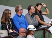 Amelie Mauresmo (R), former French tennis player and Britain's Andy Murray's coach follows his men's singles match against Facundo Arguello of Argentina at the French Open tennis tournament at the Roland Garros stadium in Paris, France, May 25, 2015. REUTERS/Jean-Paul Pelissier