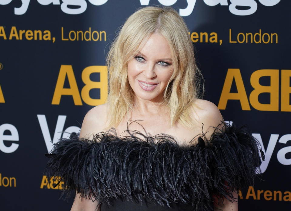 Kylie Minogue arrives for the ABBA Voyage concert at the ABBA Arena in London, Thursday May 26, 2022. ABBA is releasing its first new music in four decades, along with a concert performance that will see the "Dancing Queen" quartet going entirely digital. The virtual version of the band will begin a series of concerts on Thursday. (AP Photo/Alberto Pezzali)