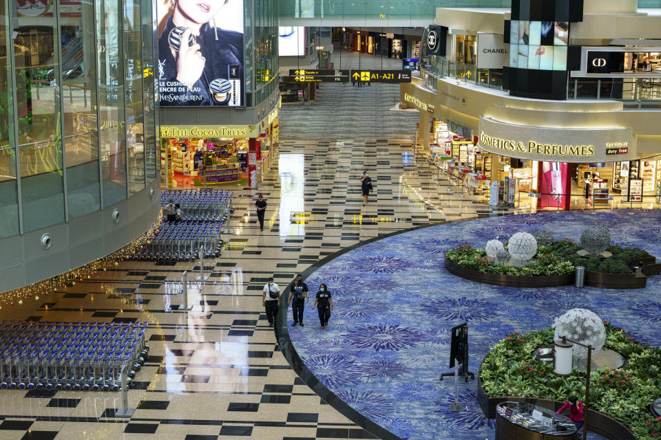 SINGAPORE, SINGAPORE - NOVEMBER 11: People walk past the departure hall after check in counter at Changi Airport Terminal 3 on November 11, 2020 in Singapore. Singapore and Hong Kong authorities announced the launch of a quarantine-free travel bubble between the two Asian financial hubs, slated to start in late November. (Photo by Ore Huiying/Getty Images)