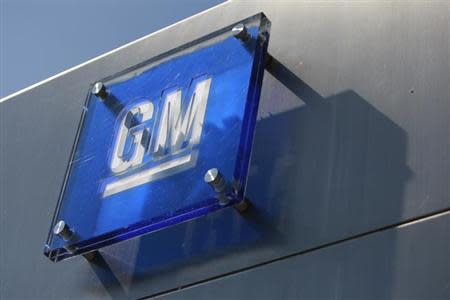 The General Motors logo is seen outside its headquarters at the Renaissance Center in Detroit, Michigan August 25, 2009. REUTERS/Jeff Kowalsky