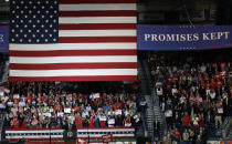 President Donald Trump gestures to a large crowd during a rally Wednesday, Oct. 31, 2018, in Estero, Fla. (AP Photo/Chris O'Meara)