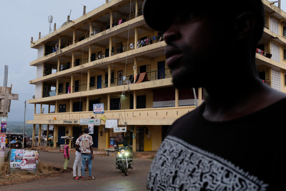 A man walks past a torn-down colonial building in Mampong, Ashanti region, Ghana. (Photo: Francis Kokoroko/Reuters)