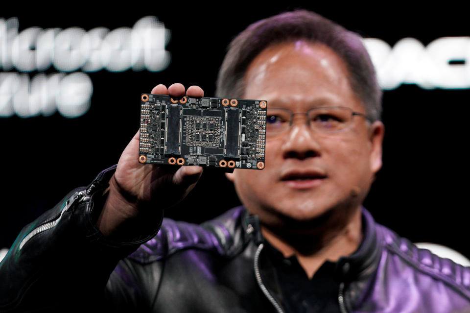 Jensen Huang, CEO of Nvidia, shows the NVIDIA Volta GPU computing platform at his keynote address at CES in Las Vegas, Nevada, U.S. January 7, 2018. REUTERS/Rick Wilking