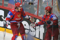 Russia's Alexander Ovechkin (L) and Alexander Syomin celebrate their team's score against Slovakia during the final game of the IIHF International Ice Hockey World Championship in Helsinki on May 20, 2012. AFP PHOTO/ ALEXANDER NEMENOVALEXANDER NEMENOV/AFP/GettyImages