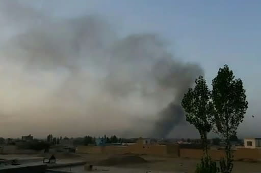 Screen grab from AFPTV video taken on August 10, 2018 shows smoke rising after Taliban militants launched an attack on the Afghan provincial capital of Ghazni