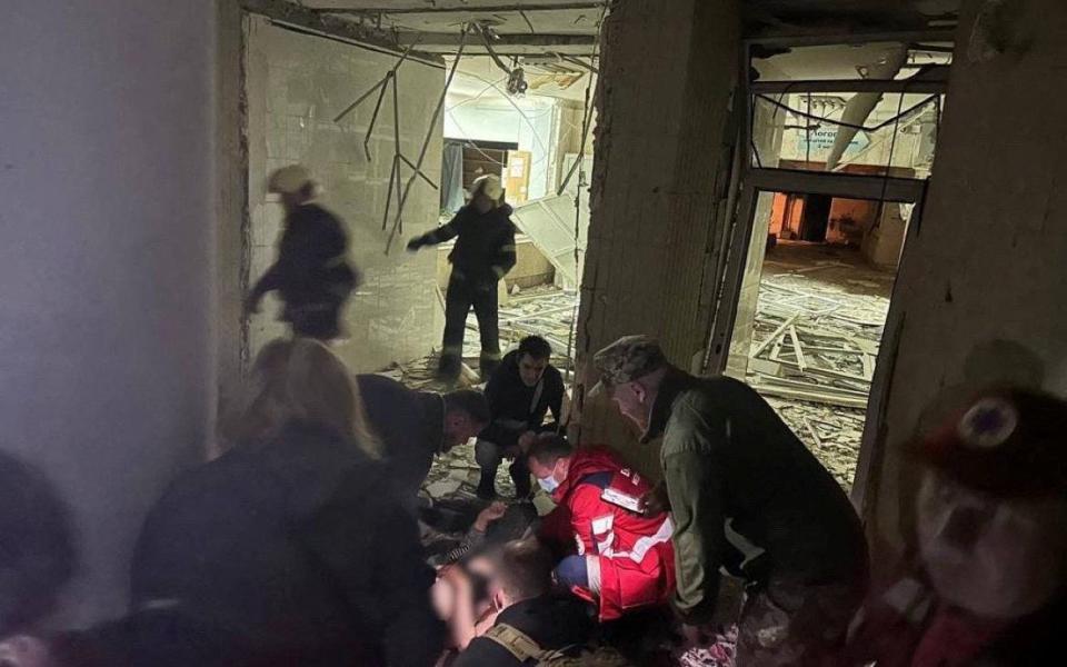 Rescuers and medics work in a local clinic, where fragments of shot down missile fell during a Russian missile strike in Kyiv - KYIV CITY MILITARY ADMINISTRATION/via REUTERS