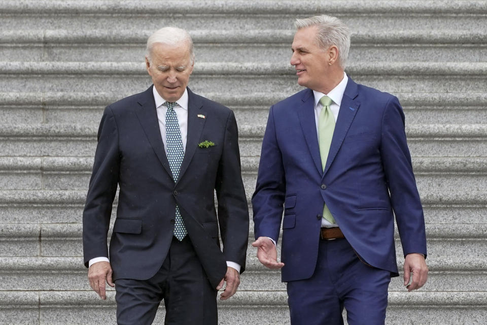 FILE - President Joe Biden and House Speaker Kevin McCarthy of Calif., walk down the House steps after attending an annual St. Patrick's Day luncheon gathering, Friday, March 17, 2023, on Capitol Hill in Washington. (AP Photo/Mariam Zuhaib, File)