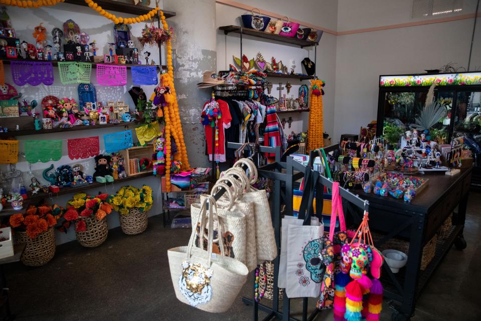 Miriam "Mili" Cordero owns Mili's Flowers and Gifts on Tuesday, Oct. 4, 2022, at Crosstown Concourse in Memphis. Patrons of the store can create their own flower bouquets as well as shop for various Mexican-made items. 