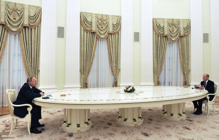 Russian President Vladimir Putin, left, and German Chancellor Olaf Scholz during their talks in the Kremlin in Moscow, Russia, Tuesday, Feb. 15, 2022. (Mikhail Klimentyev, Sputnik, Kremlin Pool Photo via AP)