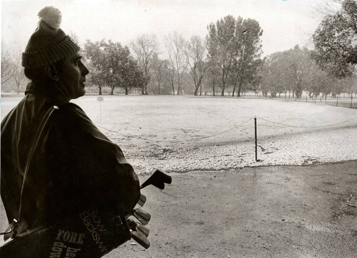 Sonny Valine wonders if it would be worth it to play a round at Land Park on February 5, 1976. He decided against it because his golf balls were the same color as the fairways. Leo Neibaur/Sacramento Bee file