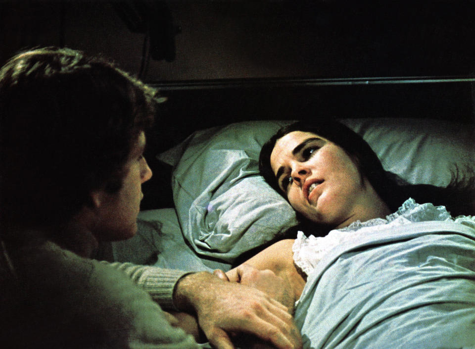 Ryan O’Neal conforts an ailing Ali MacGraw in ‘Love Story (Everett Collection)