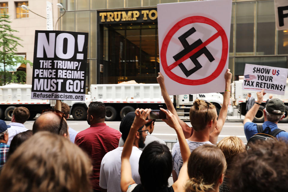 Hundreds of protesters gather outside of Trump Tower.