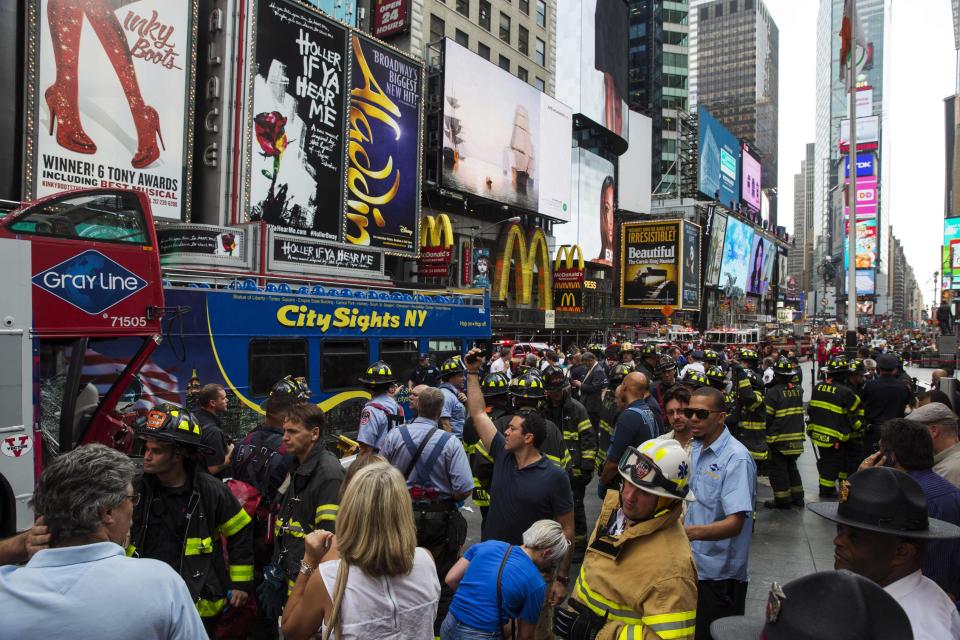 Double-decker tour buses collide in Times Square