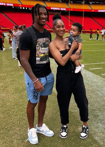 <p>Courtesy of Amina Smith</p> Deon Bush (left) and Amina Smith with their son