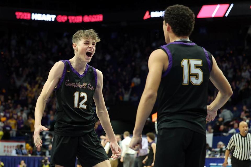 Campbell County’s Broc Sorgenfrei (12) and Garyn Jackson (15) celebrate after knocking off Newport in the first round of the Boys’ Sweet 16 in Rupp Arena on Thursday night. James Crisp