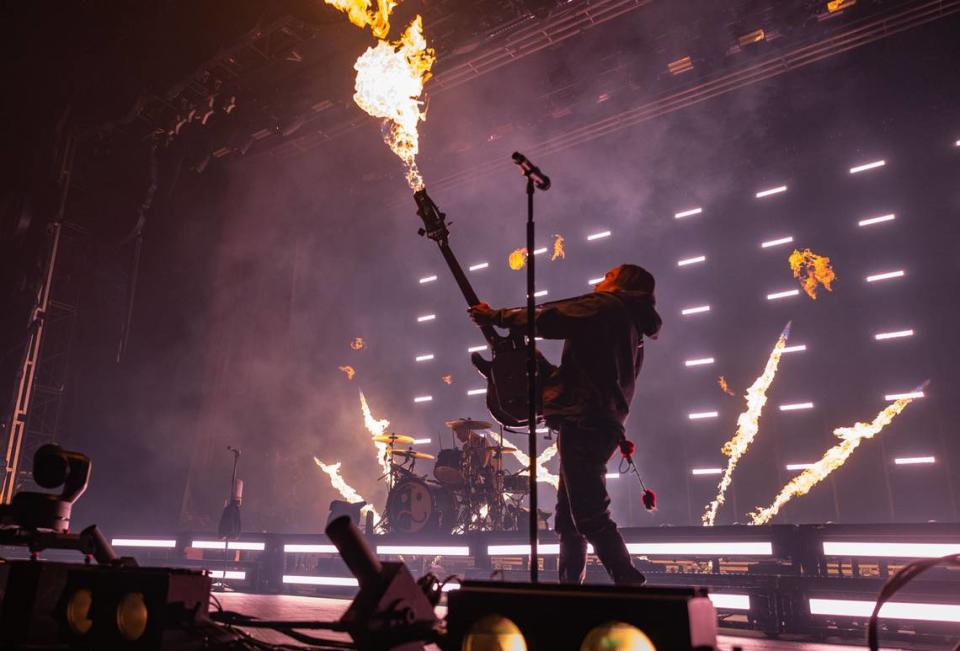 Flames shoot from the bass of Fall Out Boy’s Pete Wentz during the group’s concert on Sunday at Golden 1 Center.