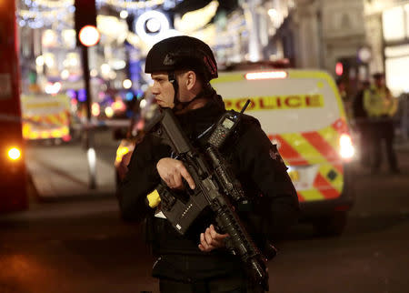 An armed police stands on Oxford Street, London, Britain November 24, 2017. REUTERS/Simon Dawson