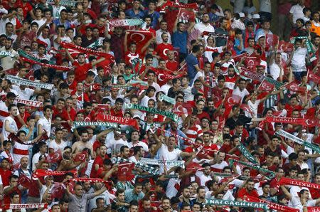 Turkish soccer fans cheer before the Euro 2016 Group A qualifying soccer match between Turkey and the Netherlands in Konya, Turkey in this September 6, 2015 file photo. REUTERS/Umit Bektas