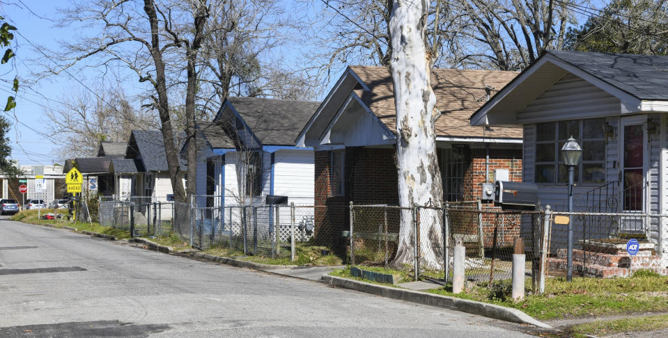 FILE - Homes line Richardson Drive in Africatown on Jan. 29, 2019, in Mobile, Ala. Republican Tommy Tuberville told people Saturday, Oct. 8, 2022, at an election rally in Nevada that Democrats support reparations for the descendants of enslaved people because “they think the people that do the crime are owed that.” His remarks cut deeply for some, especially in and around Africatown, a community in Mobile, Alabama, that was founded by descendants of Africans smuggled in 1860 to the United States aboard a schooner called the Clotilda. (AP Photo/Julie Bennett, File)