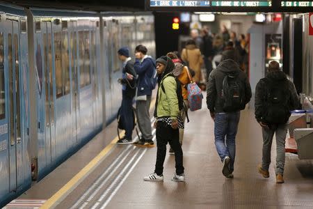 People prepare to board a subway train at the Central Station stop in Brussels, Belgium, November 25, 2015. REUTERS/Benoit Tessier