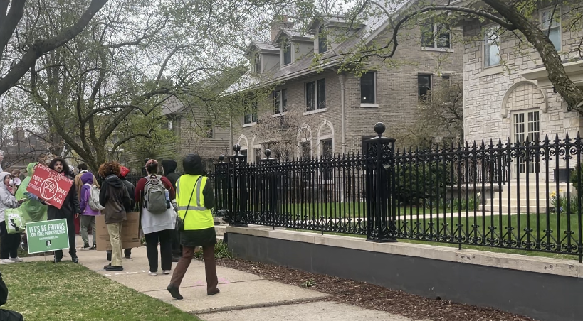 Around two dozen protesters, mostly University of Wisconsin-Milwaukee students, picketed outside Chancellor Mark Mone's residence in Shorewood Thursday evening, April 18.