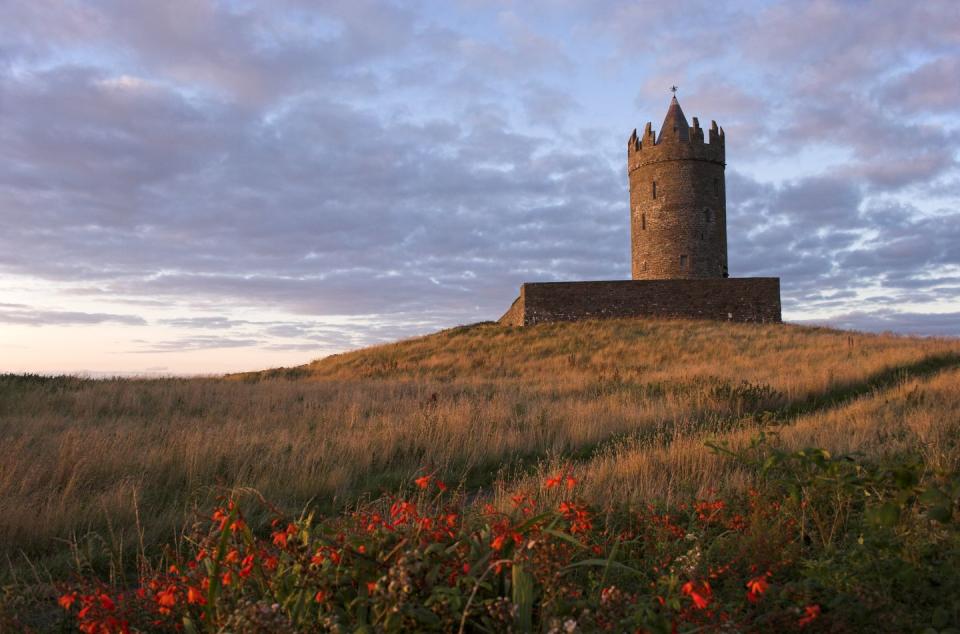 doonagore castle sunset in county clare, republic of ireland