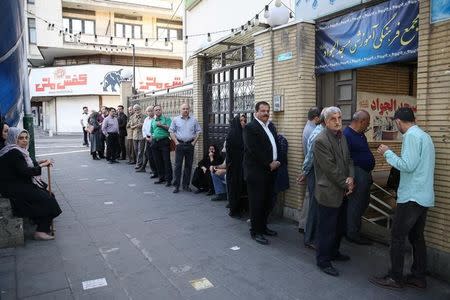 Iranian people wait for the polling station to open to vote during the presidential election in Tehran, Iran, May 19, 2017. TIMA via REUTERS