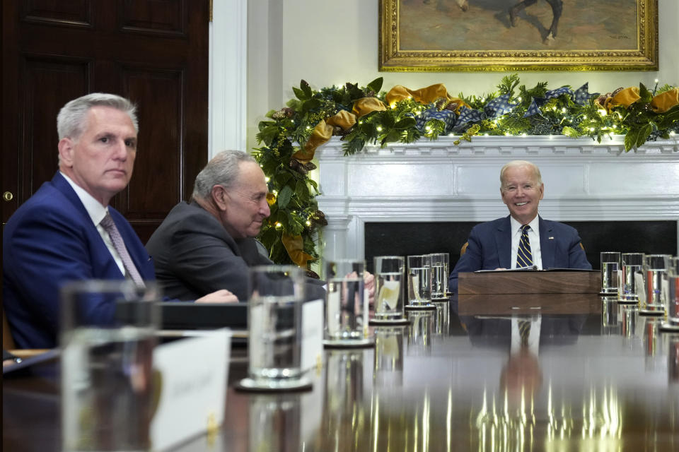 FILE - President Joe Biden, right, at the top of a meeting with congressional leaders to discuss legislative priorities for the rest of the year, Nov. 29, 2022, in the Roosevelt Room of the White House in Washington. From left are House Minority Leader Kevin McCarthy of Calif., Senate Majority Leader Chuck Schumer, of N.Y., and Biden. Biden on Tuesday night will stand before a joint session of Congress for the first time since voters in the midtem elections handed control of the House to Republicans. (AP Photo/Andrew Harnik, File)