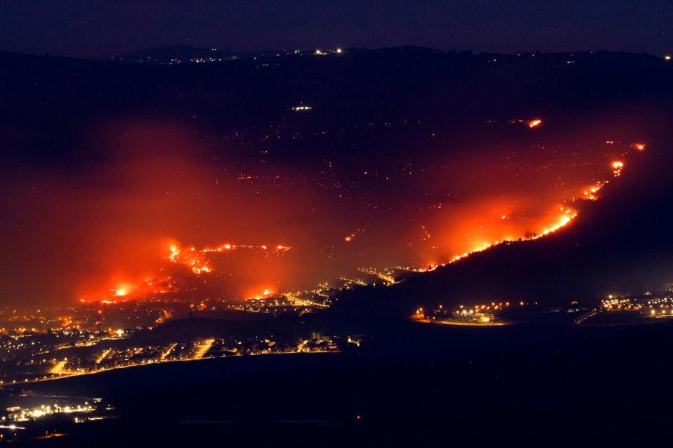 PHOTO: Fires burn as a result of rockets launched from Lebanon into northern Israel, next to the city of Kiryat Shmona near the Lebanon border, on June 3, 2024, amid ongoing cross-border clashes between Israeli troops and Hezbollah fighters. (Jalaa Marey/AFP via Getty Images)