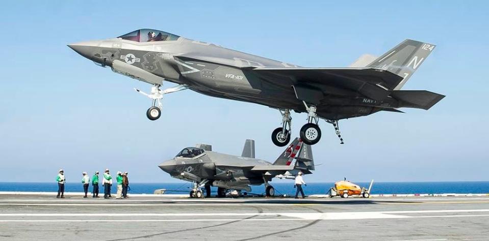 A VFA-101 F-35C lands aboard a carrier. (USN)