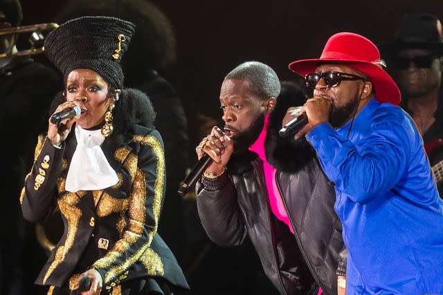 <p>Gotham/WireImage</p> Lauryn Hill, Pras Michel and Wyclef Jean of the Fugees perform in New York City in September 2023