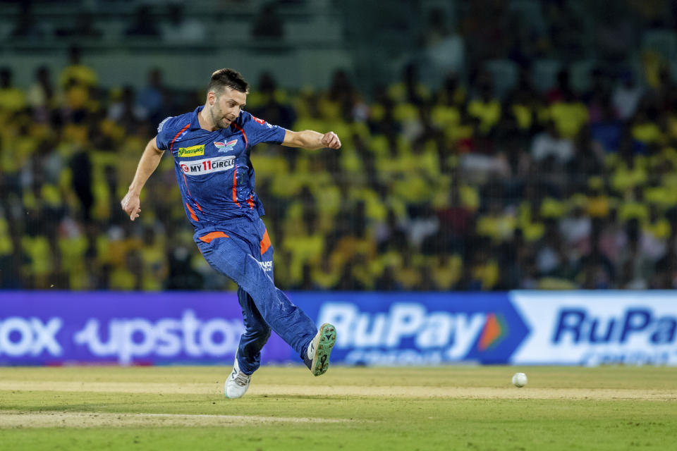 Mark Wood of Lucknow Super Giants fields with his leg during the Indian Premier League cricket match between the Chennai Super Kings and the Lucknow Super Giants in Chennai, India, Monday, April 3, 2023. (AP Photo/ R. Parthibhan)